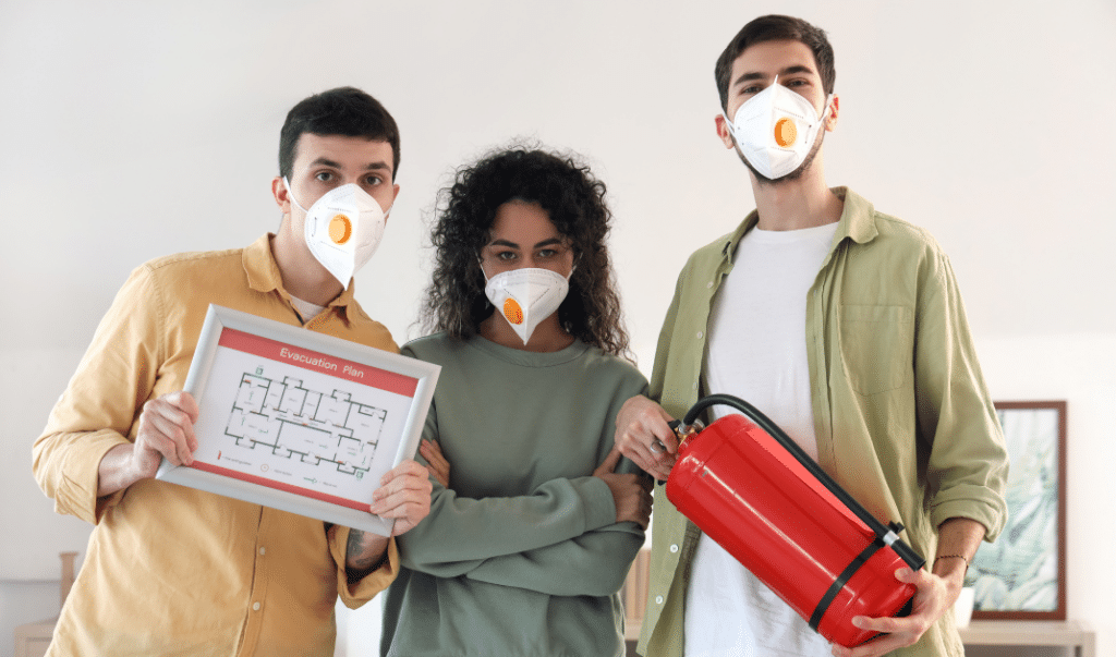 Three young people ready for fire safety with their Personal Evacuation Plan.