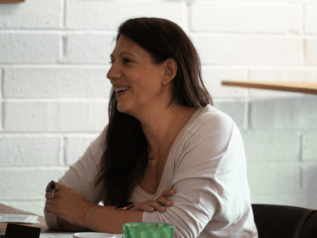 Woman smiling after hearing about the mental health guidance from the HSE.