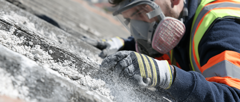 A close up of a non licensed asbestos removal taking place.