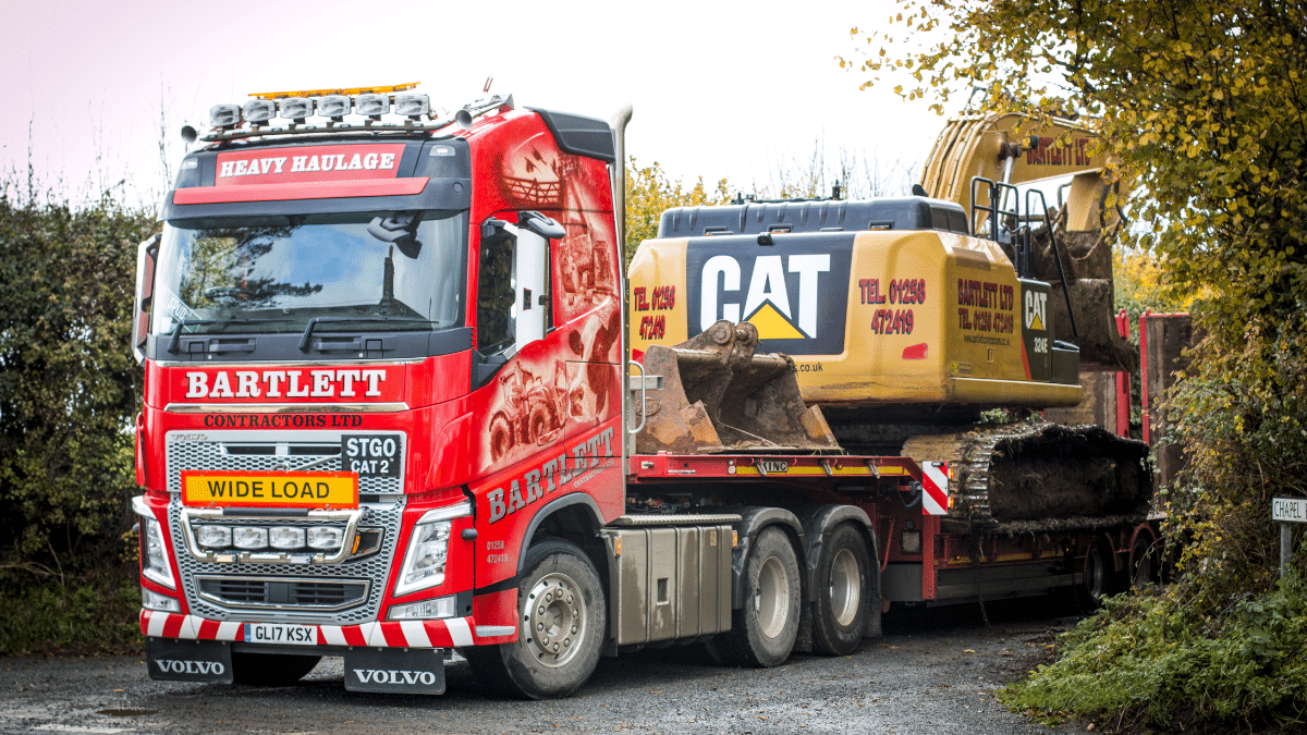 Bartlett Contractors heavy haulage vehicle transporting excavation machinery for a construction project